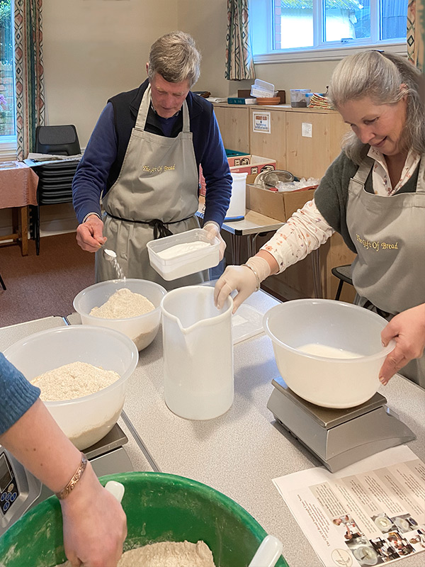 mixing ingredients for sourdough bread in class